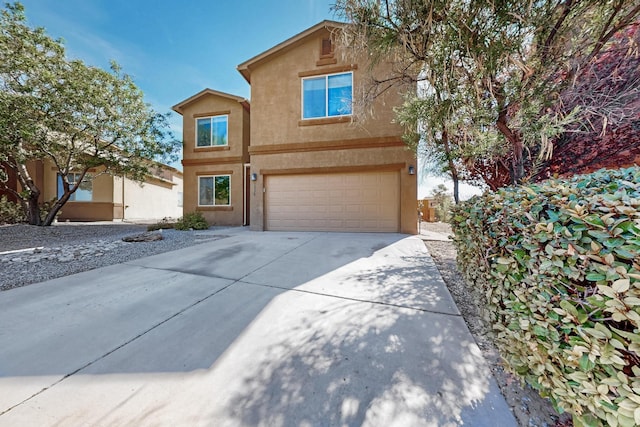 1324 Desert Paintbrush Loop, Rio Rancho, NM 87144 - view of front of property featuring stucco siding, driveway, and an attached garage