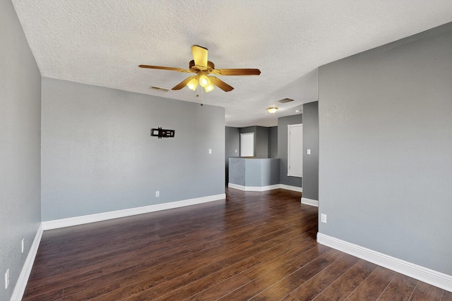 1324 Desert Paintbrush Loop, Rio Rancho, NM 87144 - empty room with a ceiling fan, a textured ceiling, and dark wood-style flooring