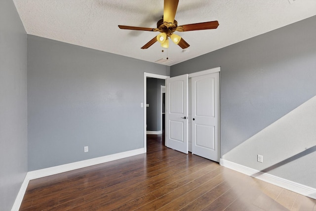 1324 Desert Paintbrush Loop, Rio Rancho, NM 87144 - unfurnished bedroom with hardwood / wood-style flooring, a closet, and a ceiling fan