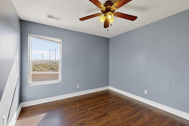 1324 Desert Paintbrush Loop, Rio Rancho, NM 87144 - unfurnished room featuring dark wood-style floors, a ceiling fan, and a textured ceiling