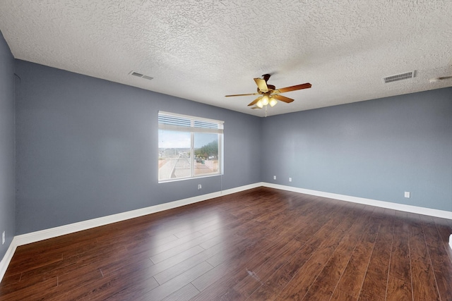 1324 Desert Paintbrush Loop, Rio Rancho, NM 87144 - spare room featuring a ceiling fan, dark wood-style flooring, and a textured ceiling
