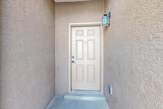 1324 Desert Paintbrush Loop, Rio Rancho, NM 87144 - doorway to property featuring stucco siding