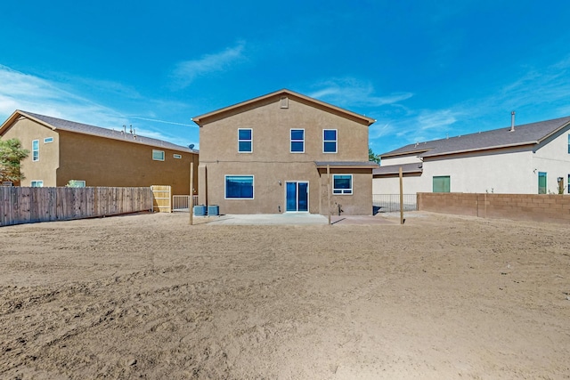 1324 Desert Paintbrush Loop, Rio Rancho, NM 87144 - rear view of property with a patio, stucco siding, and a fenced backyard
