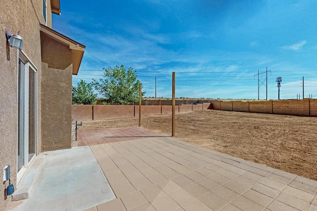 1324 Desert Paintbrush Loop, Rio Rancho, NM 87144 - fenced backyard with a patio area