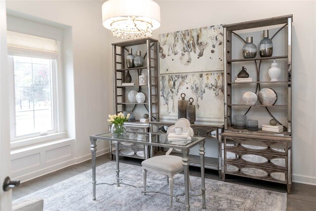 office space with an inviting chandelier and hardwood / wood-style flooring