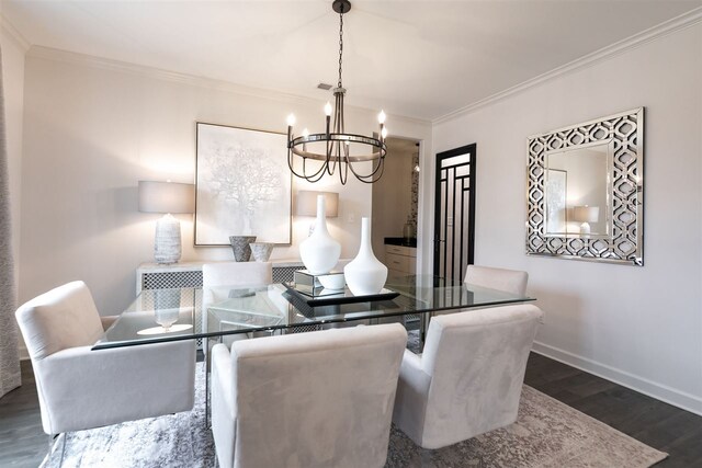 9636 Grays Meadow Dr, Cordova, TN 38018 - dining area featuring ornamental molding, an inviting chandelier, baseboards, and dark wood finished floors