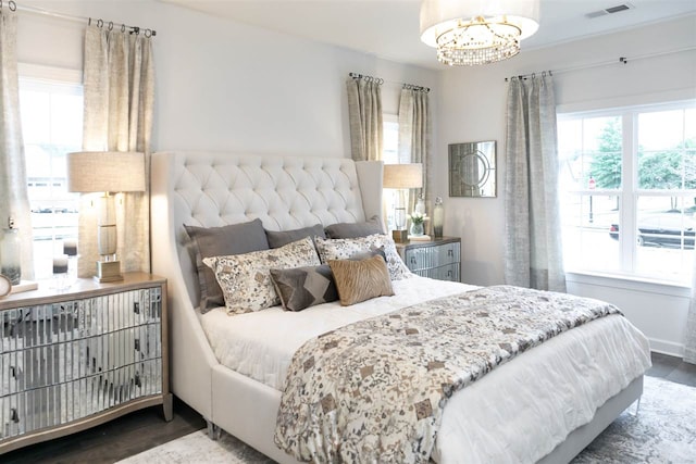 9636 Grays Meadow Dr, Cordova, TN 38018 - bedroom with visible vents, multiple windows, an inviting chandelier, and wood finished floors