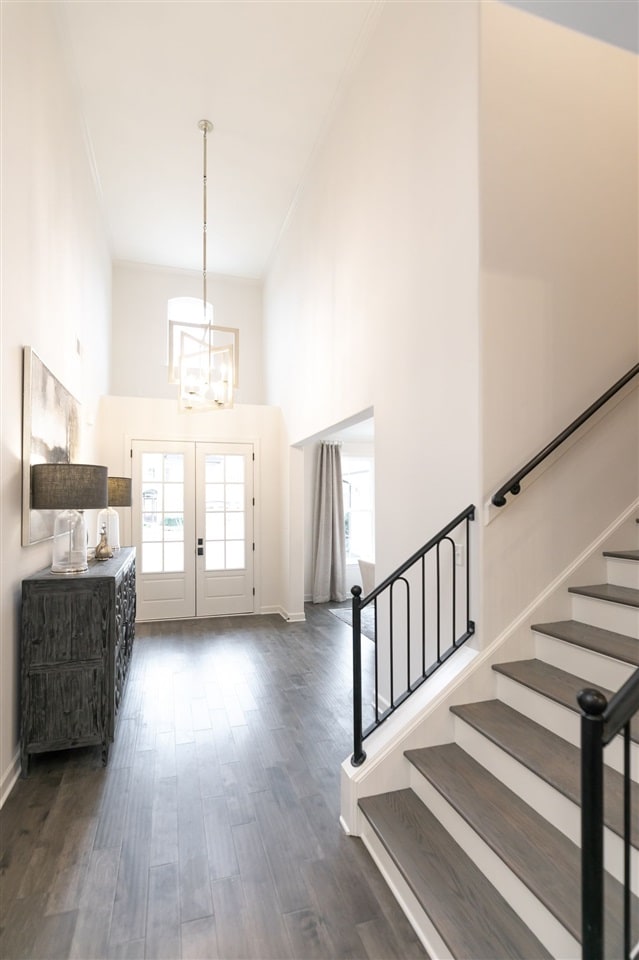 9636 Grays Meadow Dr, Cordova, TN 38018 - entrance foyer with a chandelier, a towering ceiling, stairs, and a wealth of natural light