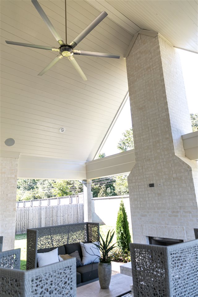 9636 Grays Meadow Dr, Cordova, TN 38018 - exterior space with an outdoor living space with a fireplace and a ceiling fan