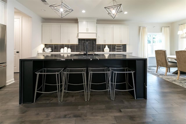 9636 Grays Meadow Dr, Cordova, TN 38018 - kitchen featuring white cabinets, recessed lighting, a spacious island, and decorative backsplash