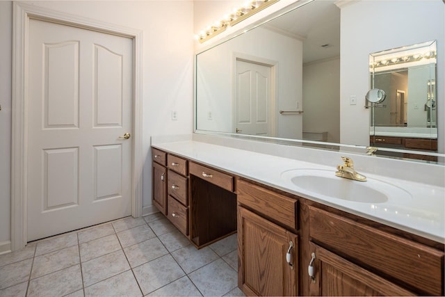 bathroom featuring ornamental molding, tile floors, and vanity