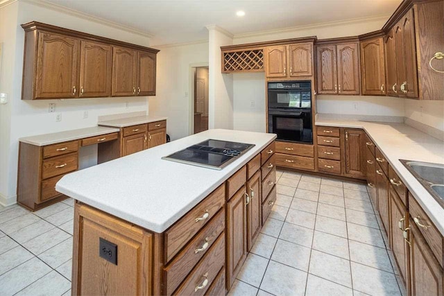 kitchen featuring a kitchen island, ornamental molding, light tile floors, and black appliances