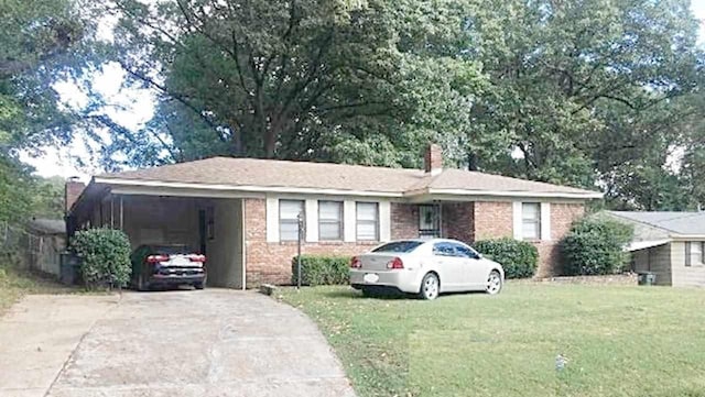 single story home featuring a carport and a front lawn