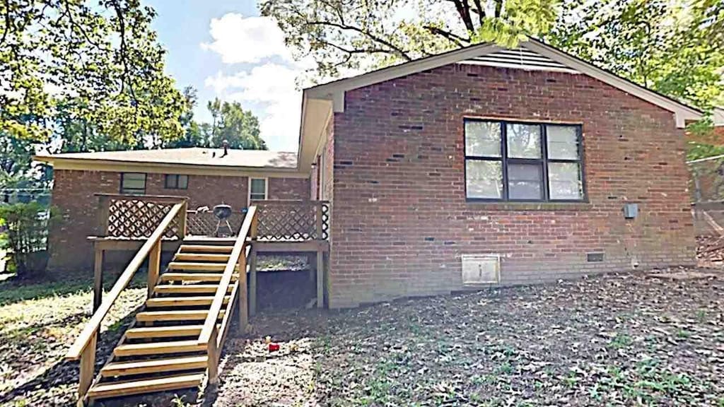 view of side of home featuring a deck