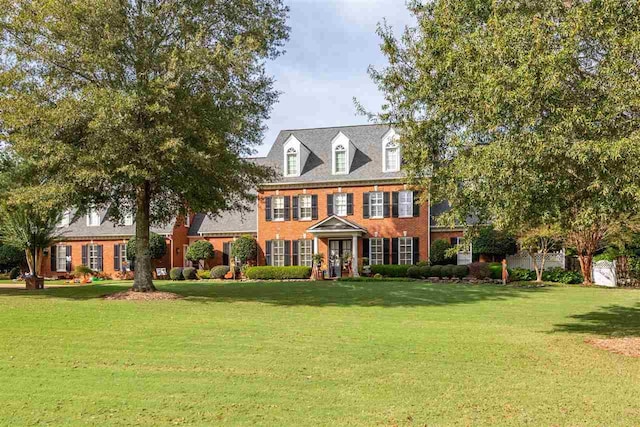 colonial home with a front yard