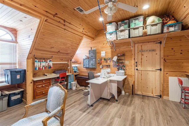 office area featuring light wood-type flooring, wooden walls, ceiling fan, lofted ceiling, and wooden ceiling