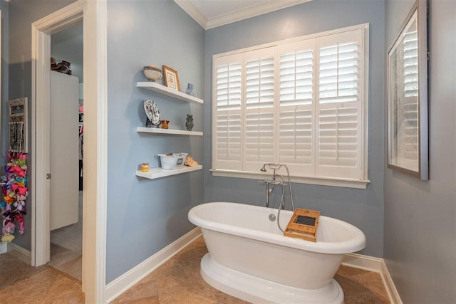 bathroom with ornamental molding, tile floors, and a bathing tub