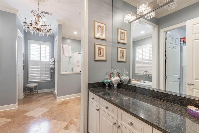 bathroom featuring a healthy amount of sunlight, tile floors, a notable chandelier, and vanity