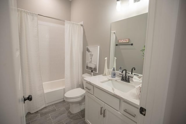 full bathroom with vanity, tile flooring, shower / bath combo with shower curtain, and toilet