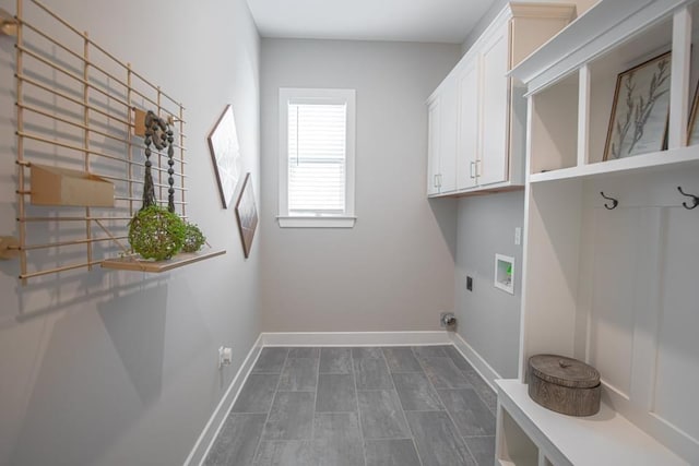 washroom featuring electric dryer hookup, washer hookup, and cabinets