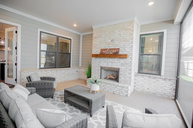 living room featuring carpet floors, ornamental molding, and a fireplace