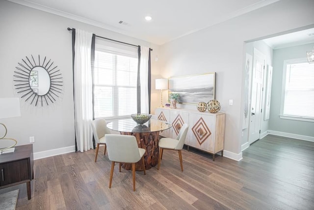 dining space with dark hardwood / wood-style floors