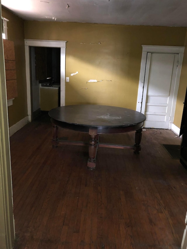 playroom with dark wood-type flooring