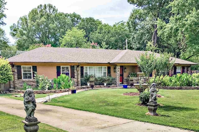 ranch-style house with a front lawn