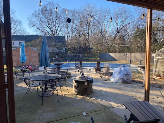 245 S Mendenhall Rd, Memphis, TN 38117 - view of patio / terrace featuring an outdoor structure and an outdoor fire pit