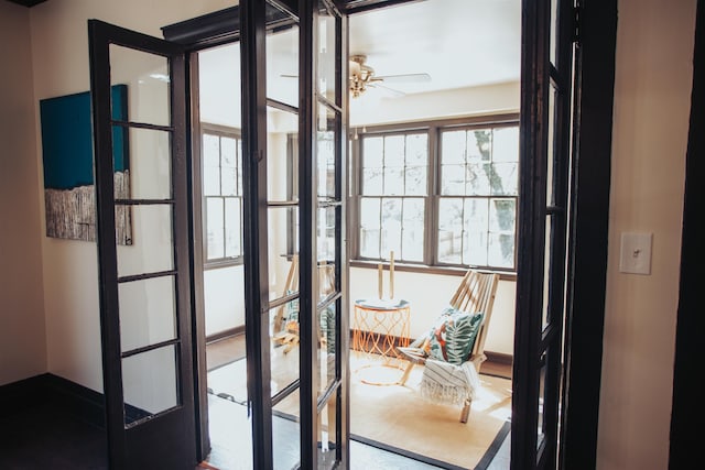 entryway with ceiling fan and french doors