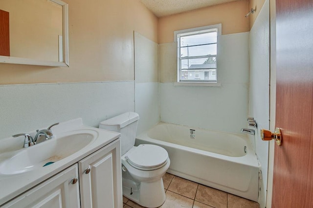 full bathroom with toilet, bathing tub / shower combination, a textured ceiling, large vanity, and tile floors