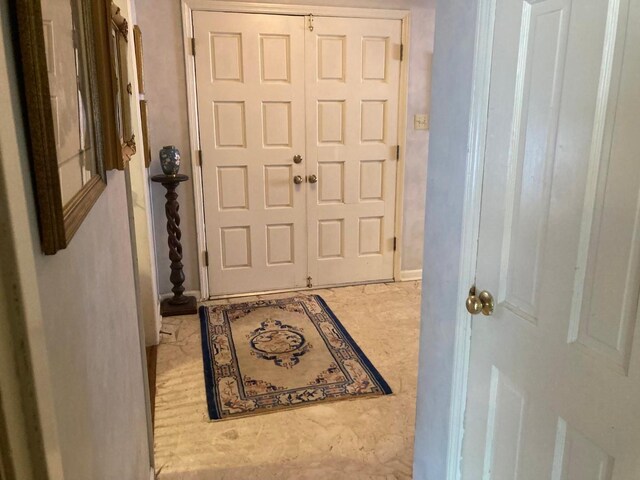 entryway with light tile flooring