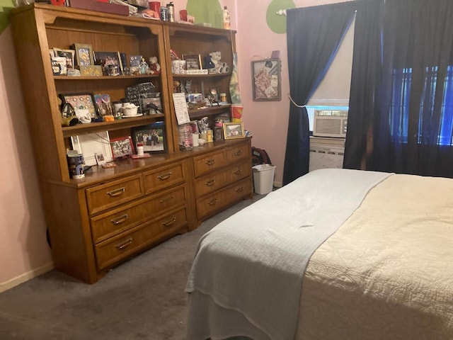 bedroom featuring dark carpet