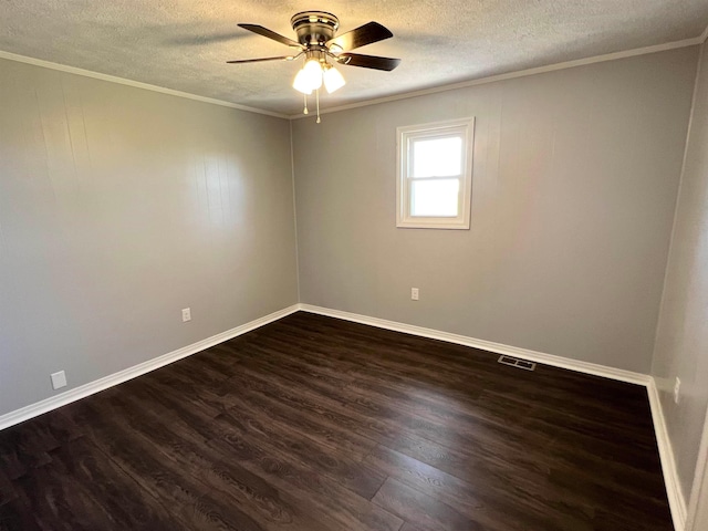 empty room featuring dark wood-type flooring, ceiling fan, a textured ceiling, and crown molding