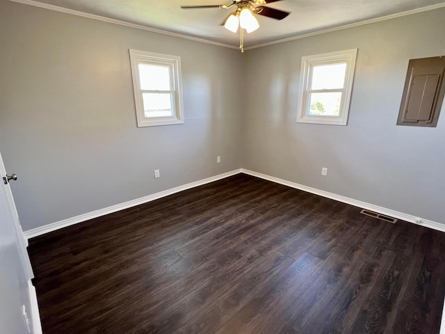 unfurnished room featuring ceiling fan, crown molding, and dark wood-type flooring