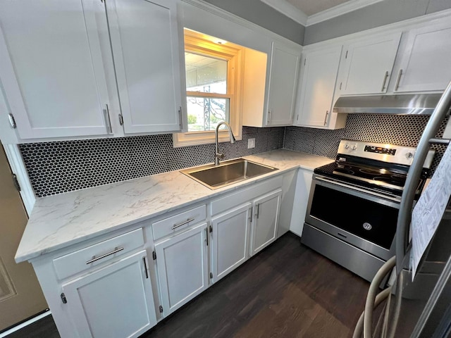 kitchen with sink, tasteful backsplash, and white cabinets