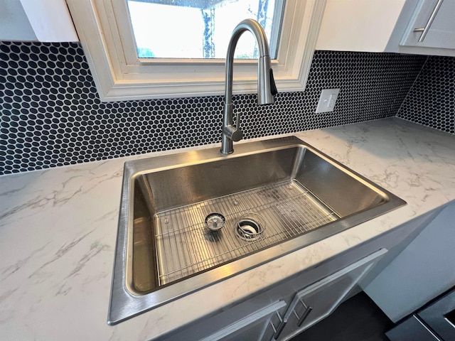 room details with sink and tasteful backsplash