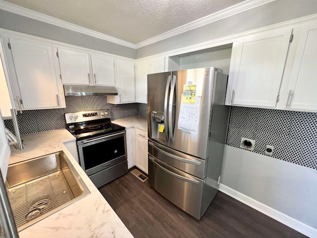 kitchen featuring white cabinets, tasteful backsplash, dark wood-type flooring, and appliances with stainless steel finishes