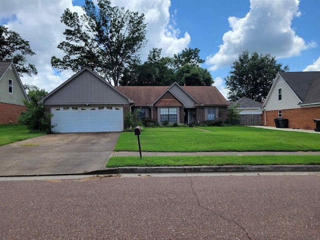 view of front of property featuring a garage and a front yard