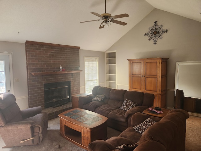 living room with ceiling fan, high vaulted ceiling, brick wall, carpet flooring, and a brick fireplace