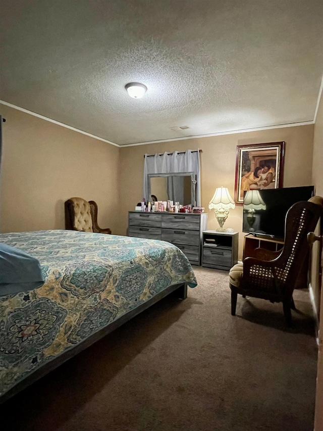 bedroom featuring a textured ceiling, ornamental molding, and carpet