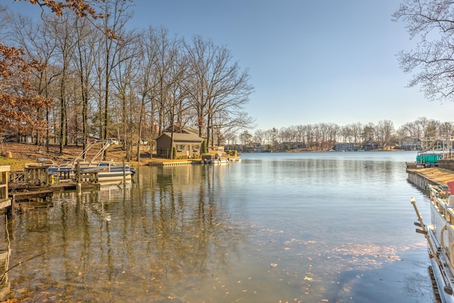 property view of water with a dock