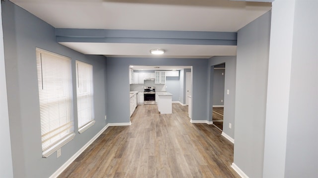 hallway featuring wood-type flooring