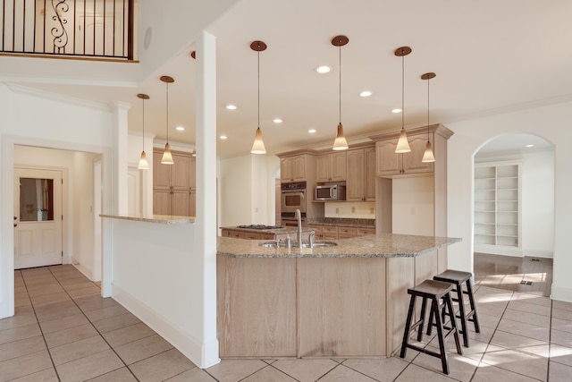 1615 Cedar Lake Cir, Hernando, MS 38632 - kitchen with appliances with stainless steel finishes, light tile floors, decorative light fixtures, sink, and light stone countertops
