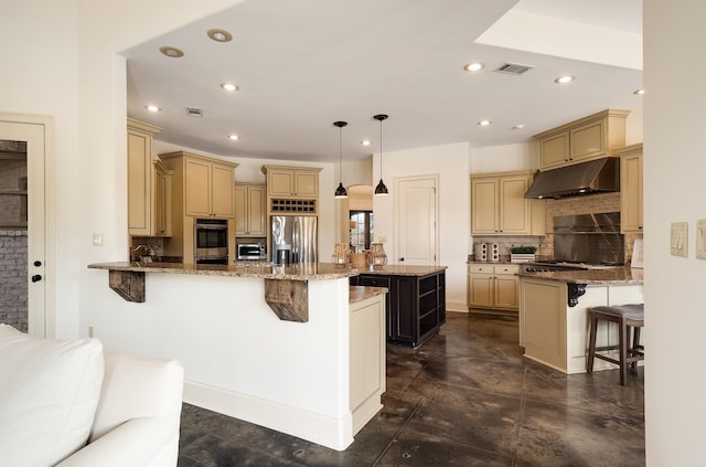 11911 Pete Dr, Collierville, TN 38017 - kitchen featuring hanging light fixtures, a breakfast bar, stainless steel appliances, kitchen peninsula, and light stone countertops