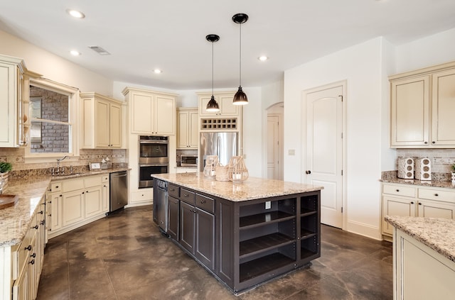 11911 Pete Dr, Collierville, TN 38017 - kitchen with tasteful backsplash, hanging light fixtures, a center island, and stainless steel appliances