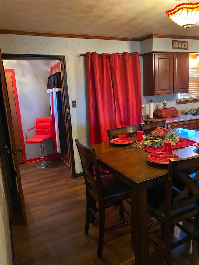 dining area with dark hardwood / wood-style floors