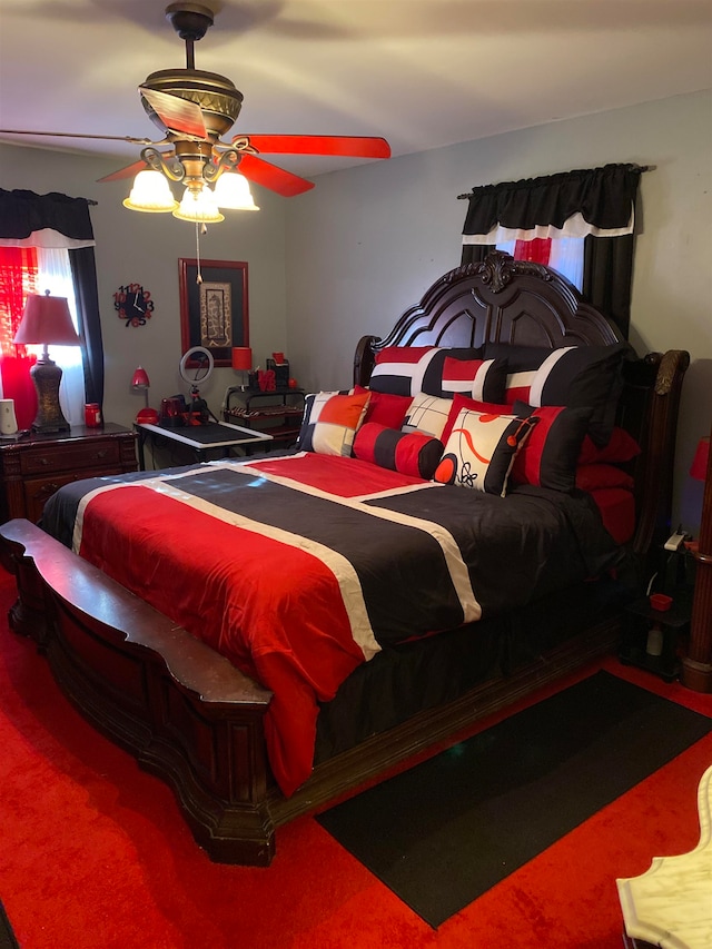 bedroom with ceiling fan and carpet floors