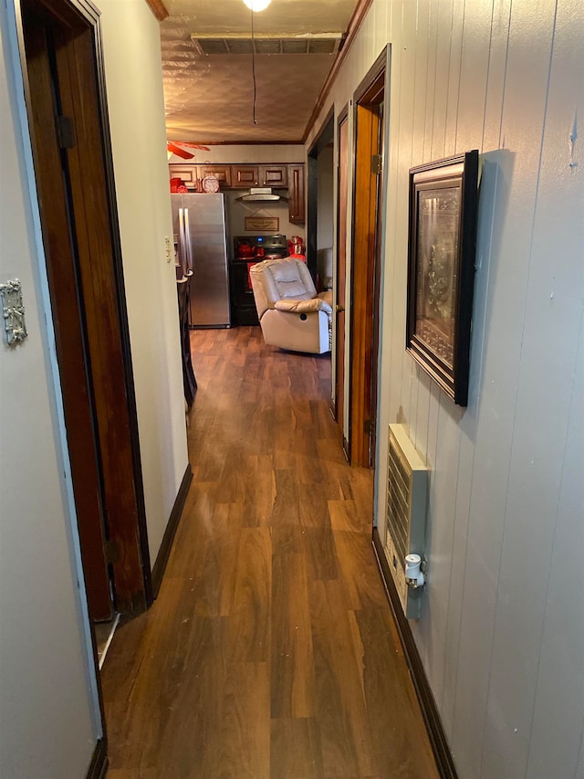 corridor featuring dark hardwood / wood-style flooring