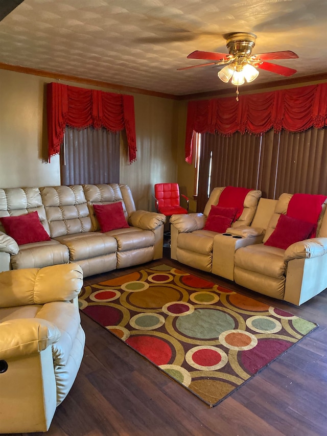 living room featuring ceiling fan and dark hardwood / wood-style floors